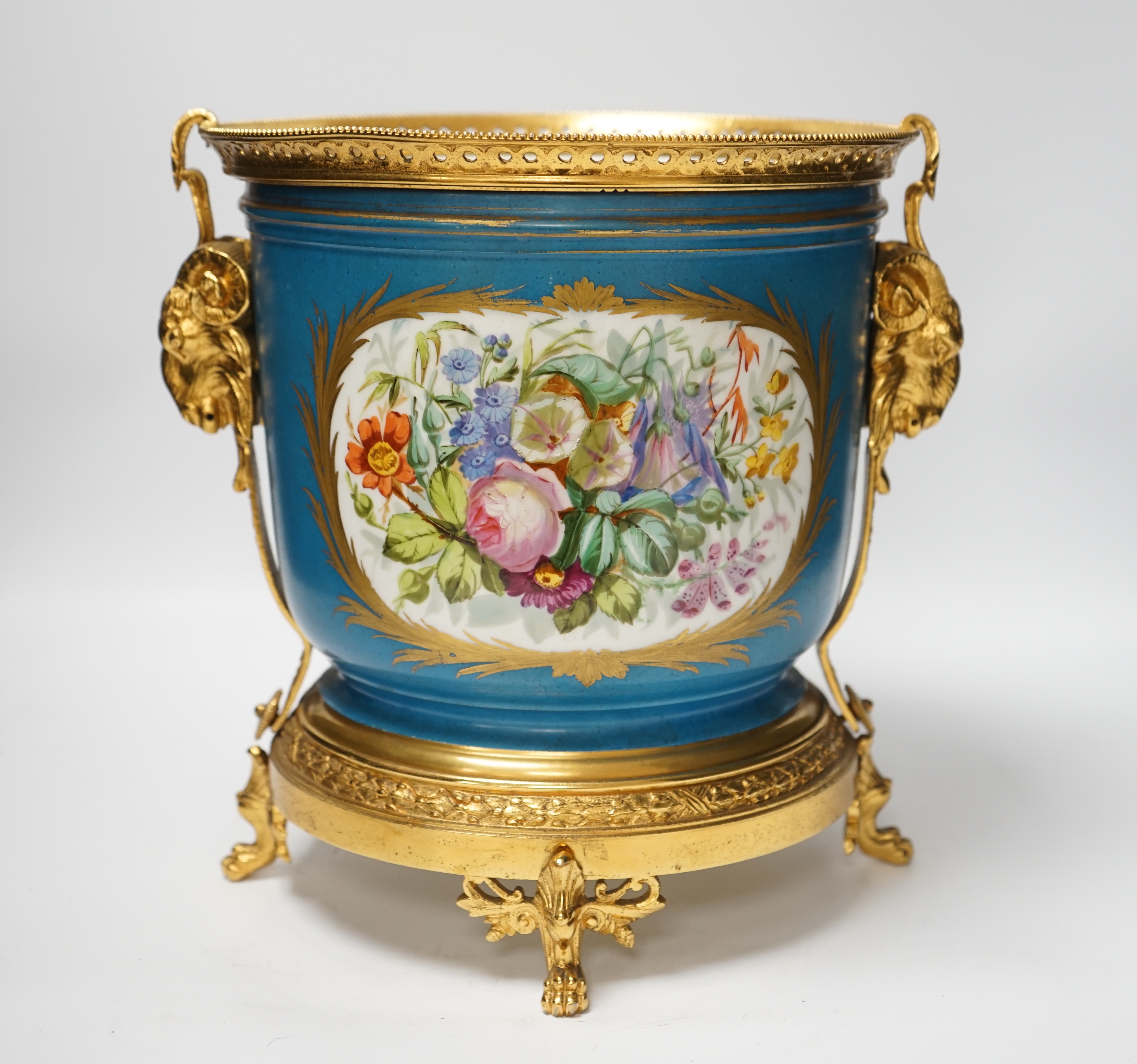 A late 19th century Sevres style jardiniere, turquoise ground with gilt rams head metal mounts, 28cm high